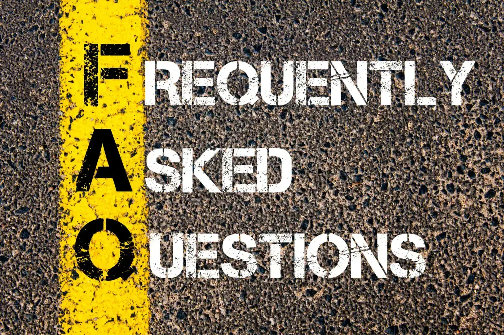 A textured sign reads 'FAQ Frequently Asked Questions' with yellow and white text.