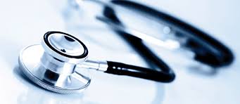Close-up of a stethoscope on a reflective surface.